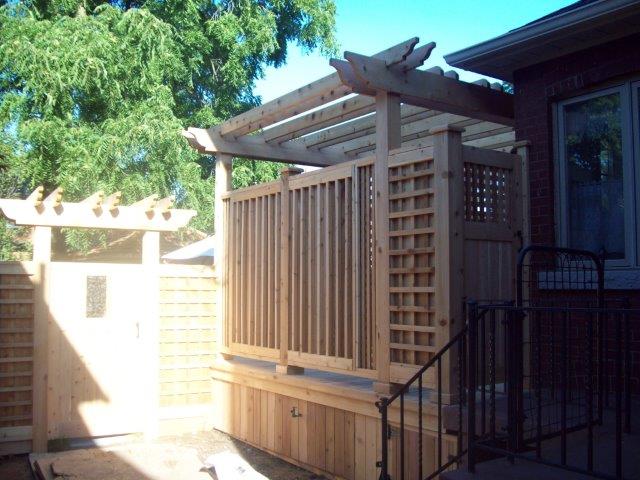 John and Clair, rear cedar fence before.