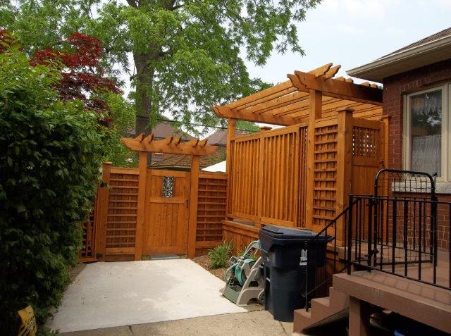 John and Clair, rear cedar fence after.