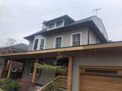 Sanding wood on family home